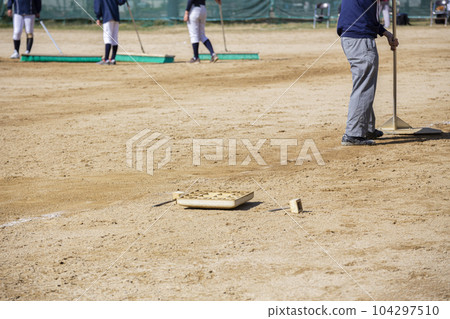 Baseball ground maintenance after the game Baseball ground maintenance after the game 104297510