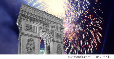 Celebratory colorful fireworks over the Arc de Triomphe, Paris, France 104298310