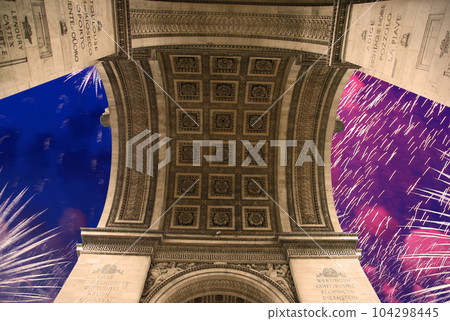 Celebratory colorful fireworks over the Arc de Triomphe, Paris, France 104298445