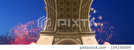 Celebratory colorful fireworks over the Arc de Triomphe, Paris, France 104298499