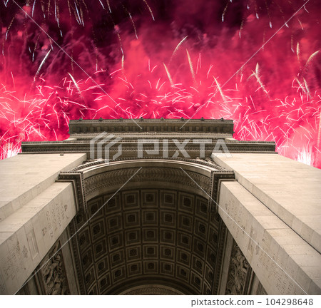 Celebratory colorful fireworks over the Arc de Triomphe, Paris, France 104298648
