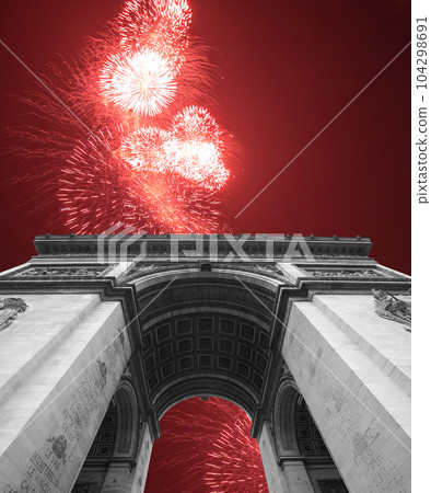 Celebratory colorful fireworks over the Arc de Triomphe, Paris, France 104298691