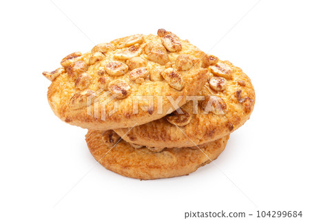 Round shortbread cookies with peanuts. Isolated on white background. 104299684