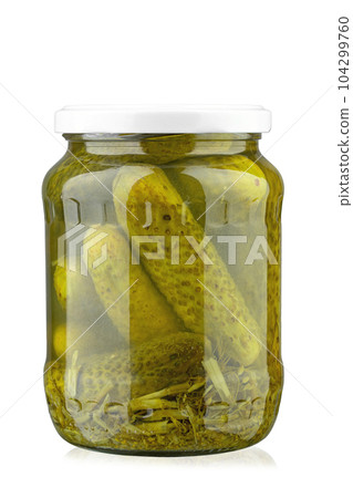 Canned cucumbers in a jar. Isolated on white background. Canned cucumbers in a jar. Isolated on white background. 104299760