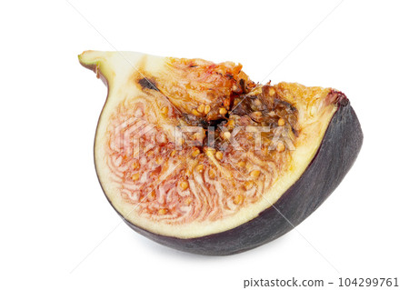 Half a ripe fresh fig. Isolated on white background. Half a ripe fresh fig. Isolated on white background. 104299761