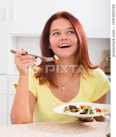 girl enjoying salad girl enjoying salad 104300598