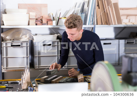 Young architect making architectural model Young architect making architectural model 104300636