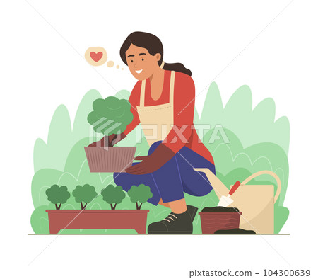 Woman Planting a Tree in Garden 104300639