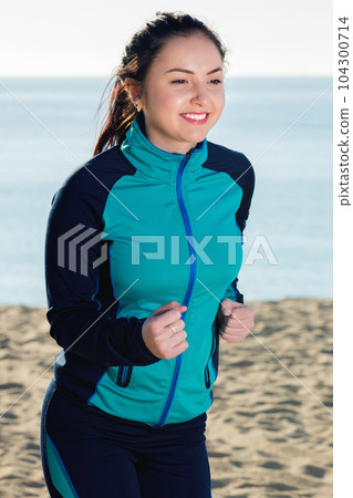 Woman doing walking training at daytime Woman doing walking training at daytime 104300714