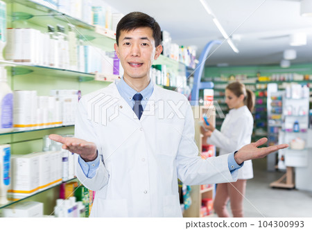 Glad korean man is standing with medicines Glad korean man is standing with medicines 104300993