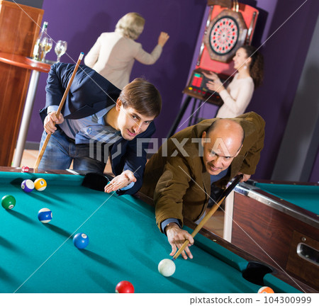 People playing billiard 104300999