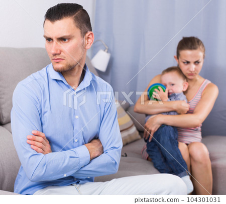 gloomy man and woman with crying son quarreled 104301031