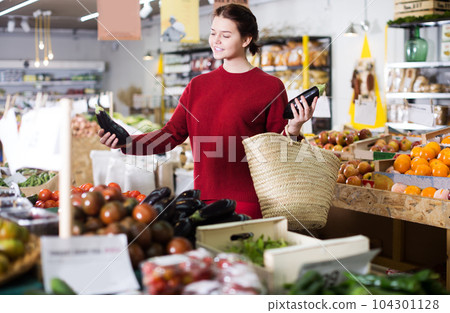 Customer looking eggplants 104301128