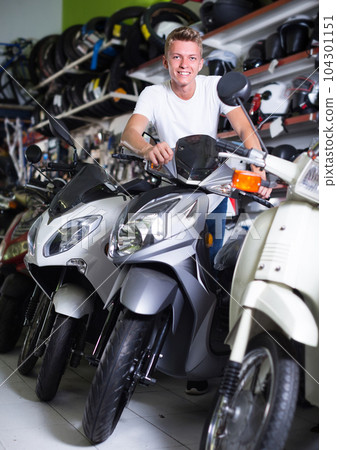 Portrait of buyer man who is satisfied by purchase 104301151