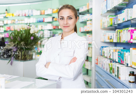 woman apothecary is standing on work place woman apothecary is standing on work place 104301243