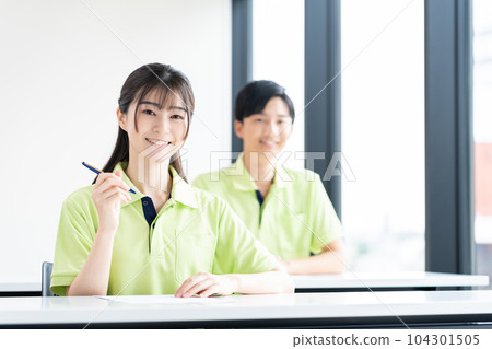 Young care workers undergoing training 104301505