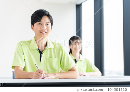 Young care workers undergoing training Young care workers undergoing training 104301510