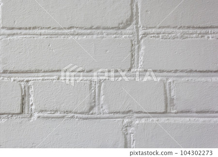 White brick wall, ideal as a backdrop for design 104302273