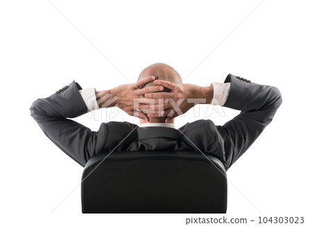 Successful businessman is relaxing after a stressed day of work Successful businessman is relaxing after a stressed day of work 104303023