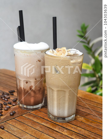 Coffee beverages on wooden table with coffee beans Coffee beverages on wooden table with coffee beans 104303639