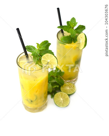 Mango mojito in highball glass with sliced lime isolated on white background Mango mojito in highball glass with sliced lime isolated on white background 104303676