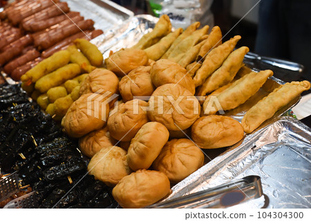 Many snacks and seafood in vietnamese night market in food festival Many snacks and seafood in vietnamese night market in food festival 104304300
