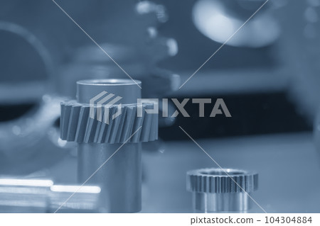 Close-up scene of transmission  gear spare parts in the light blue scene. 104304884
