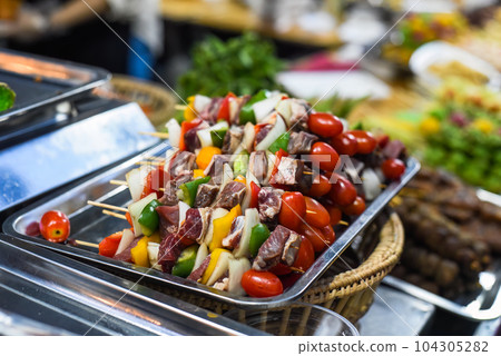 Raw shashlik with vegetables before grill Raw shashlik with vegetables before grill 104305282