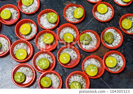 Many prepared plates with vietnamese spices with salt, pepper, lime 104305323