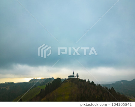 Beautiful aerial view of a st. Jakob church near Medvode, Slovenia on a hill Beautiful aerial view of a st. Jakob church near Medvode, Slovenia on a hill 104305841