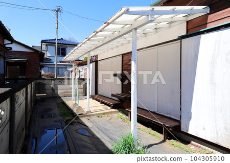 Edge side of an old private house 104305910