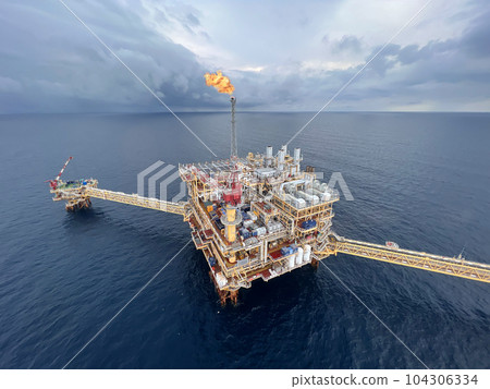 Offshore construction platform for production oil and gas. Oil and gas industry and hard work. Production platform and operation process by manual and auto function from control room. Offshore construction platform for production oil and gas. Oil and gas industry and hard work. Production platform and operation process by manual and auto function from control room. 104306334
