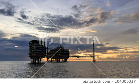 Offshore construction platform for production oil and gas. Oil and gas industry and hard work. Production platform and operation process by manual and auto function from control room. Offshore construction platform for production oil and gas. Oil and gas industry and hard work. Production platform and operation process by manual and auto function from control room. 104306337