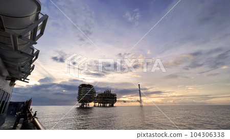 Offshore construction platform for production oil and gas. Oil and gas industry and hard work. Production platform and operation process by manual and auto function from control room. Offshore construction platform for production oil and gas. Oil and gas industry and hard work. Production platform and operation process by manual and auto function from control room. 104306338