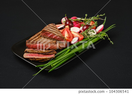 Grilled tri-tip loin beef steaks medium rare 104306541