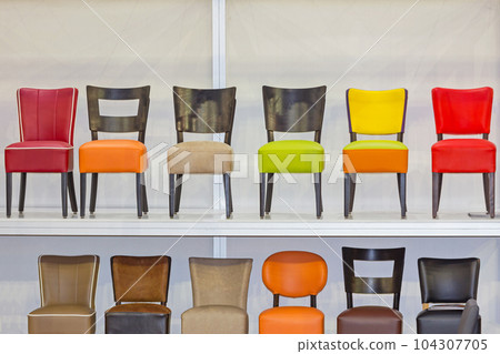 Colour Chairs in Row 104307705