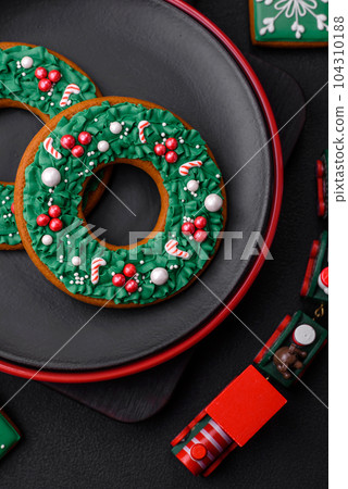 Beautiful bright colorful homemade gingerbread cookies on a ceramic plate Beautiful bright colorful homemade gingerbread cookies on a ceramic plate 104310188