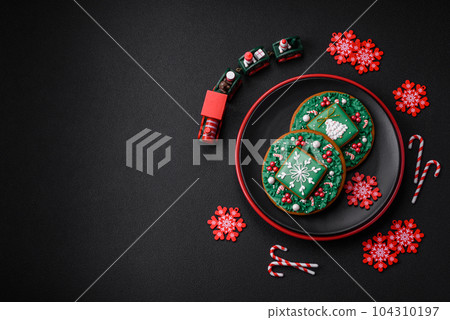 Beautiful bright colorful homemade gingerbread cookies on a ceramic plate Beautiful bright colorful homemade gingerbread cookies on a ceramic plate 104310197