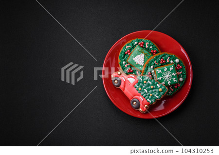 Beautiful bright colorful homemade gingerbread cookies on a ceramic plate 104310253