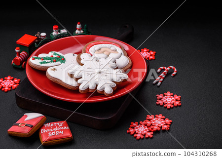 Beautiful bright colorful homemade gingerbread cookies on a ceramic plate 104310268