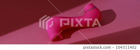 Sex toy for women also called vacuum clitoral stimulator for satisfaction on pink background Sex toy for women also called vacuum clitoral stimulator for satisfaction on pink background 104311402