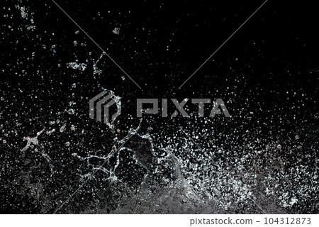 Blur Defocus Image of Water hit wall ground, explode into drop droplet. Amount Water attack impact and fluttering in air explosion. Stop motion freeze shot. Splash Water for texture elements 104312873