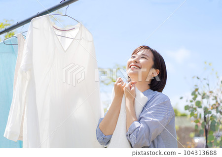 Photo of a woman doing laundry 104313688