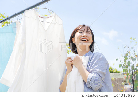 Photo of a woman doing laundry 104313689