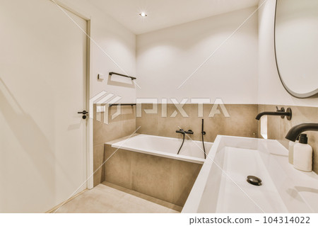a modern bathroom with two sinks and a large mirror on the wall in the background is an open shower stall a modern bathroom with two sinks and a large mirror on the wall in the background is an open shower stall 104314022