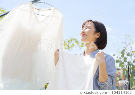 Photo of a woman doing laundry 104314103