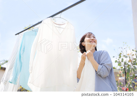 Photo of a woman doing laundry 104314105