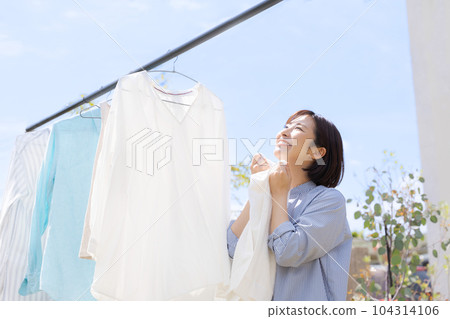 Photo of a woman doing laundry 104314106