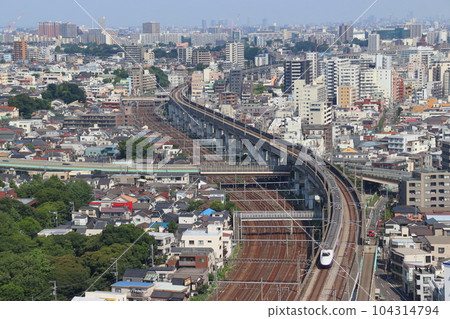 Joetsu Shinkansen E2 series passing near Oji 104314794