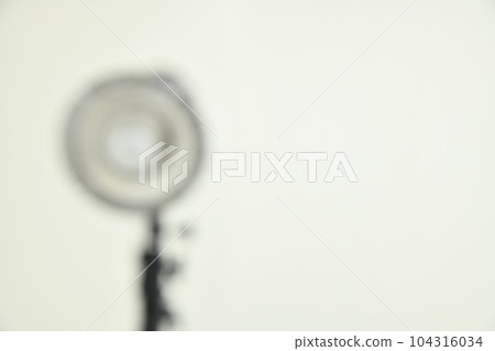 a dim light fixture against a white background a dim light fixture against a white background 104316034